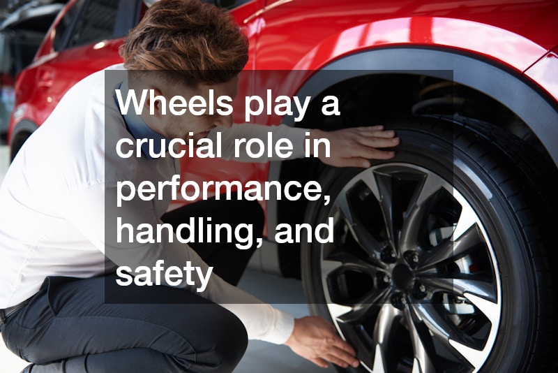 professionally dressed man checking a red car's wheels